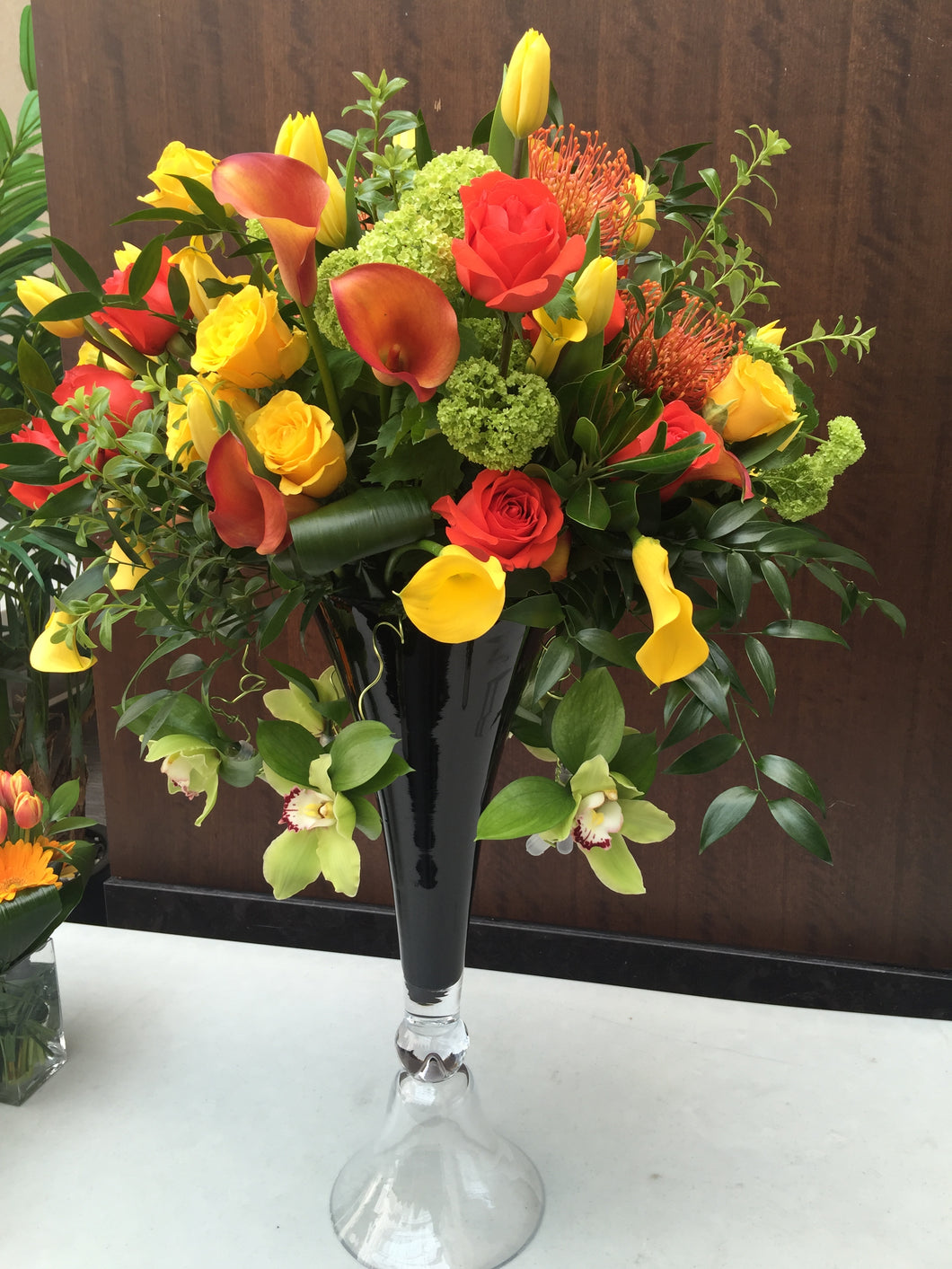 E16 - Orange, Yellow and Chartreuse Reception Arrangement (black vase sold out) - Flowerplustoronto