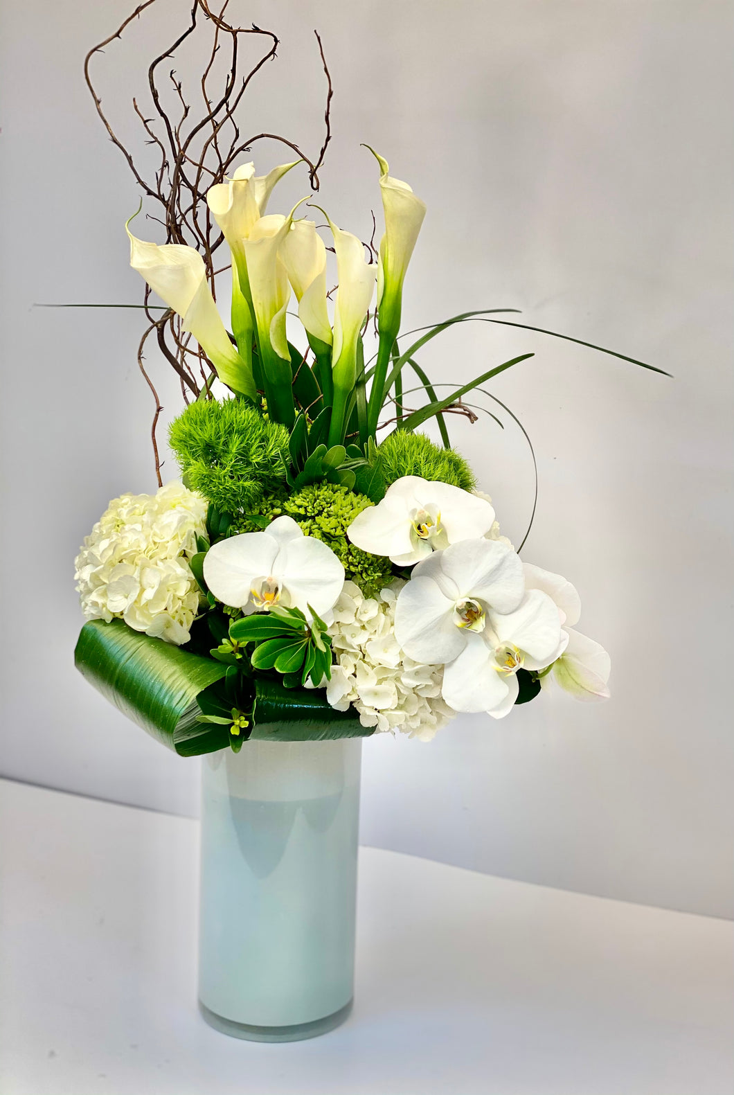 F139 - Modern White and Green Arrangement (White vase sold out, substituting clear vase with leaf wrap) - Flowerplustoronto