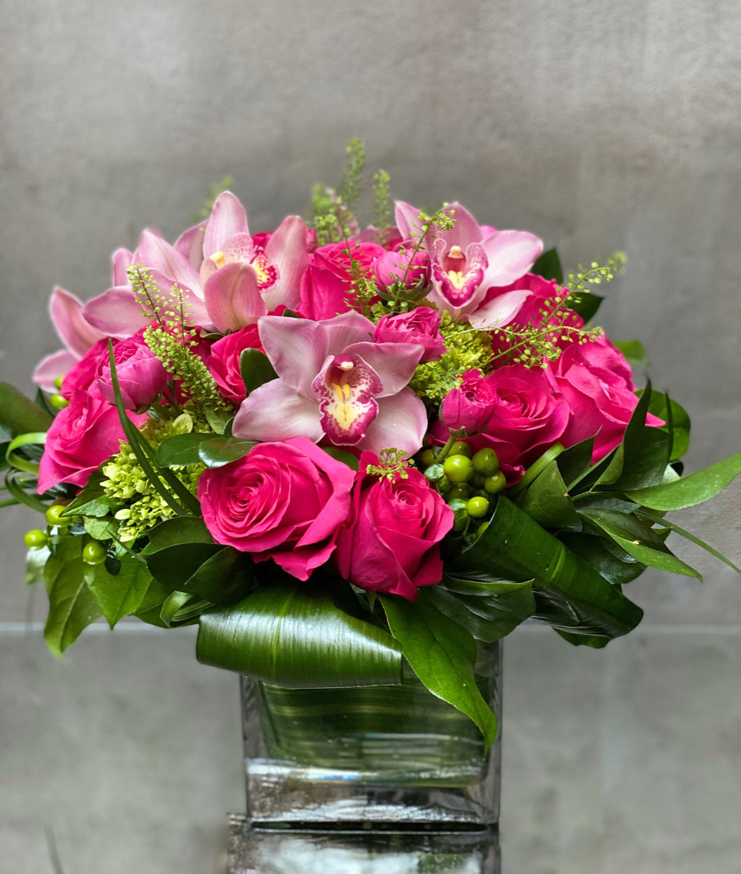 F202 - Modern Rose, Ranunculus and Cymbidium Arrangement (Cymbidium orchid colour based on availability - white, light pink or dark pink)